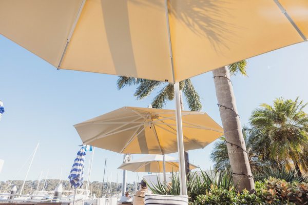 Three Revolvashade Commercial Cantilever Umbrellas at Motor Yacht Club Broken Bay.