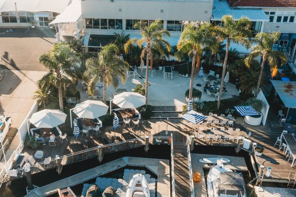 Three Revolvashade Commercial Cantilever Umbrellas at Motor Yacht Club Broken Bay. Heavy duty outdoor umbrellas which are perfect for exposed or coastal winds.